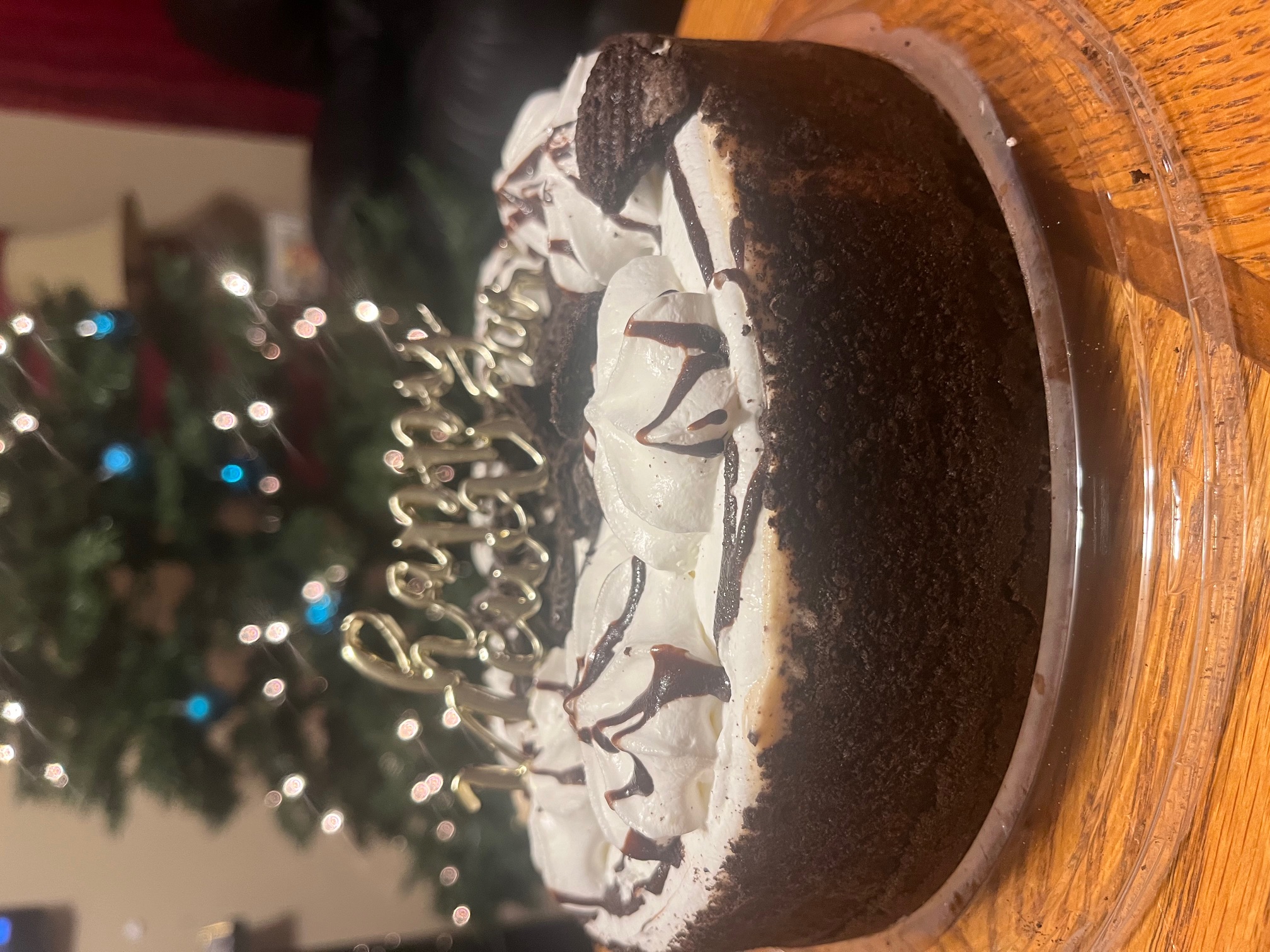 Picture of an oreo cake with a sign that says 'Happy New Year'